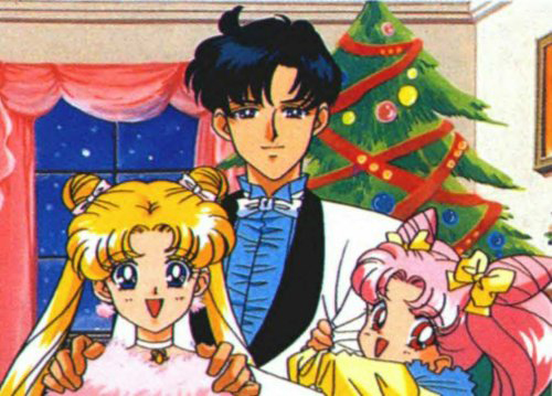 Sailor Moon Christmas image featuring Serena/Usagi, Darien/Mamoru, and Rini/Chibi Usa in front of a Christmas tree.